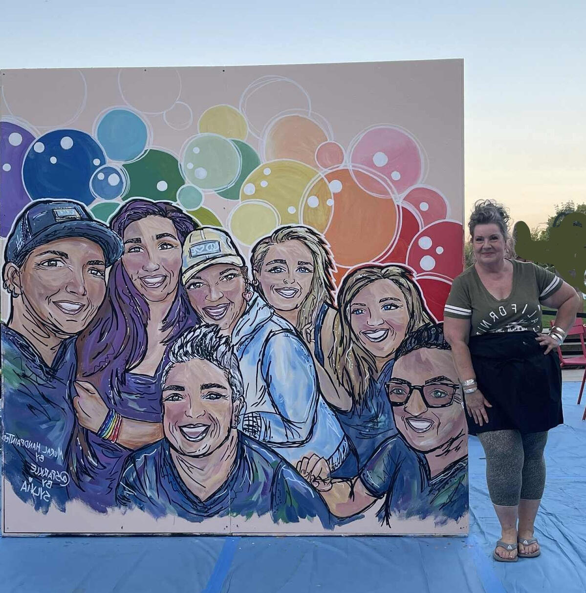 Faces of Community Mural, Redmond WA 2025 painted by Sparkle by Sylvia Sparkle by Sylvia Mural Artist, Yakima WA